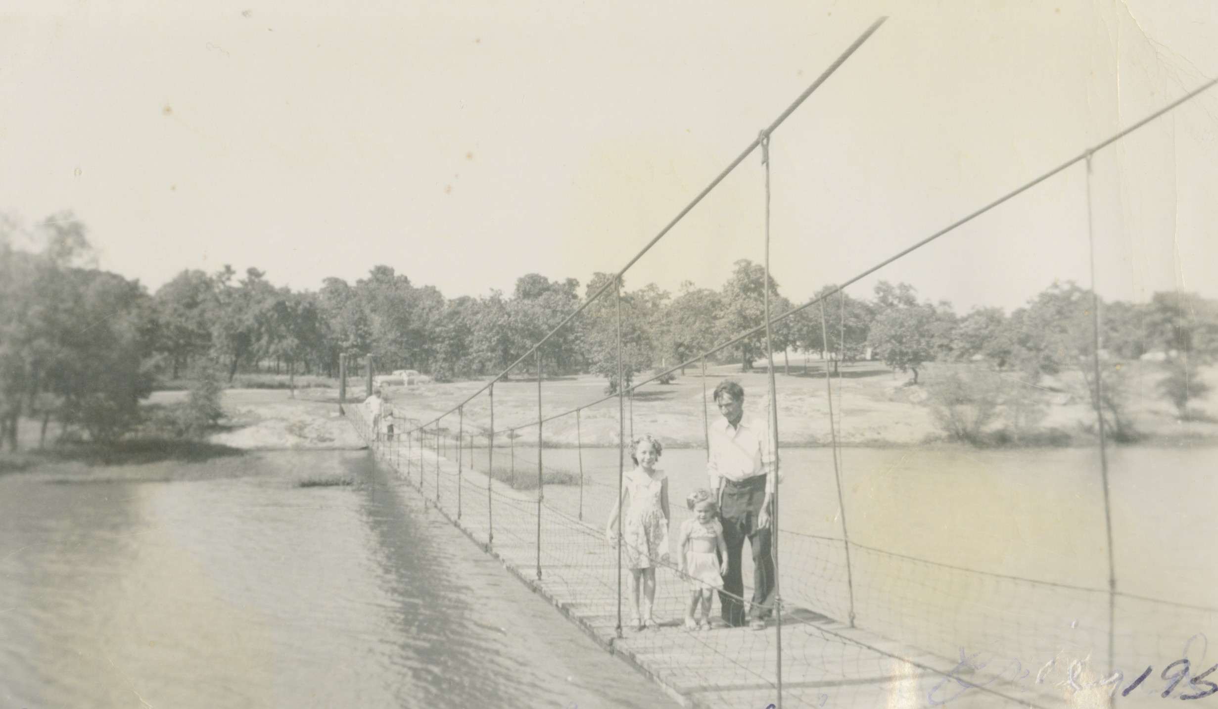 Carolyn and friends crossing a bridge Wilson Family Album